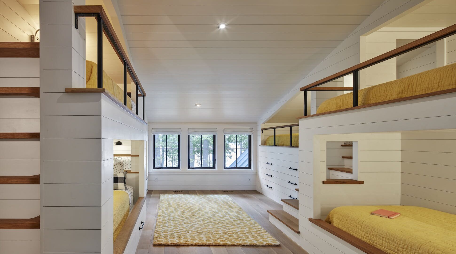 Several modern bunkbeds in a cabin in Wisconsin.